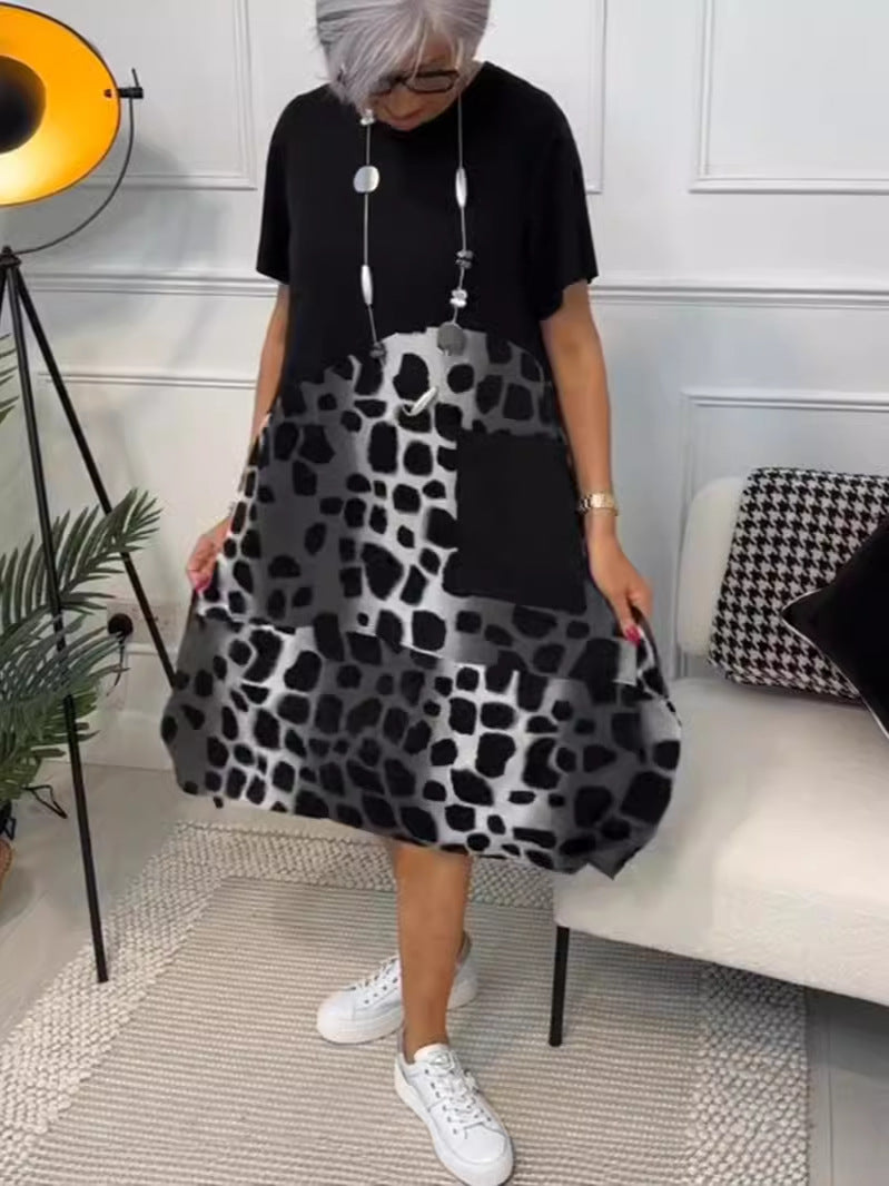 Hansine – løs kjole med print og lommer